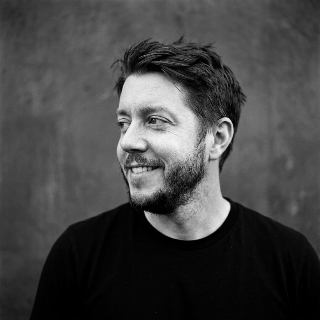 Black and white portrait of Adam Deer, founder of The Big Bad Good